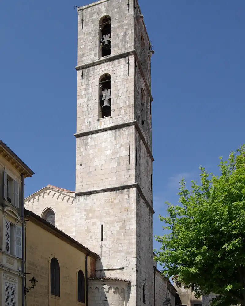 Bell tower of Notre-Dame-du-Puy cathedral in Grasse under a blue sky