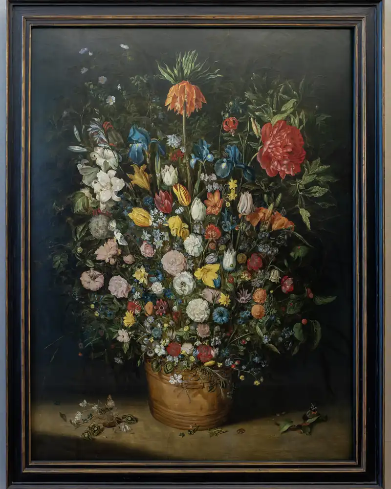 Jan Brueghel the Elder painting: an abundant bouquet of mixed flowers in a vase