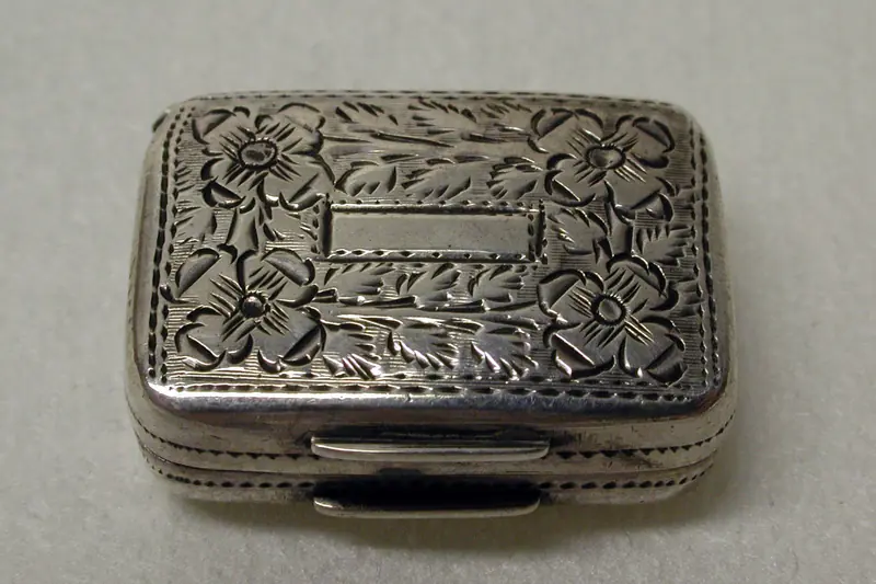 English silver vinaigrette chased with flowers, a small scent box